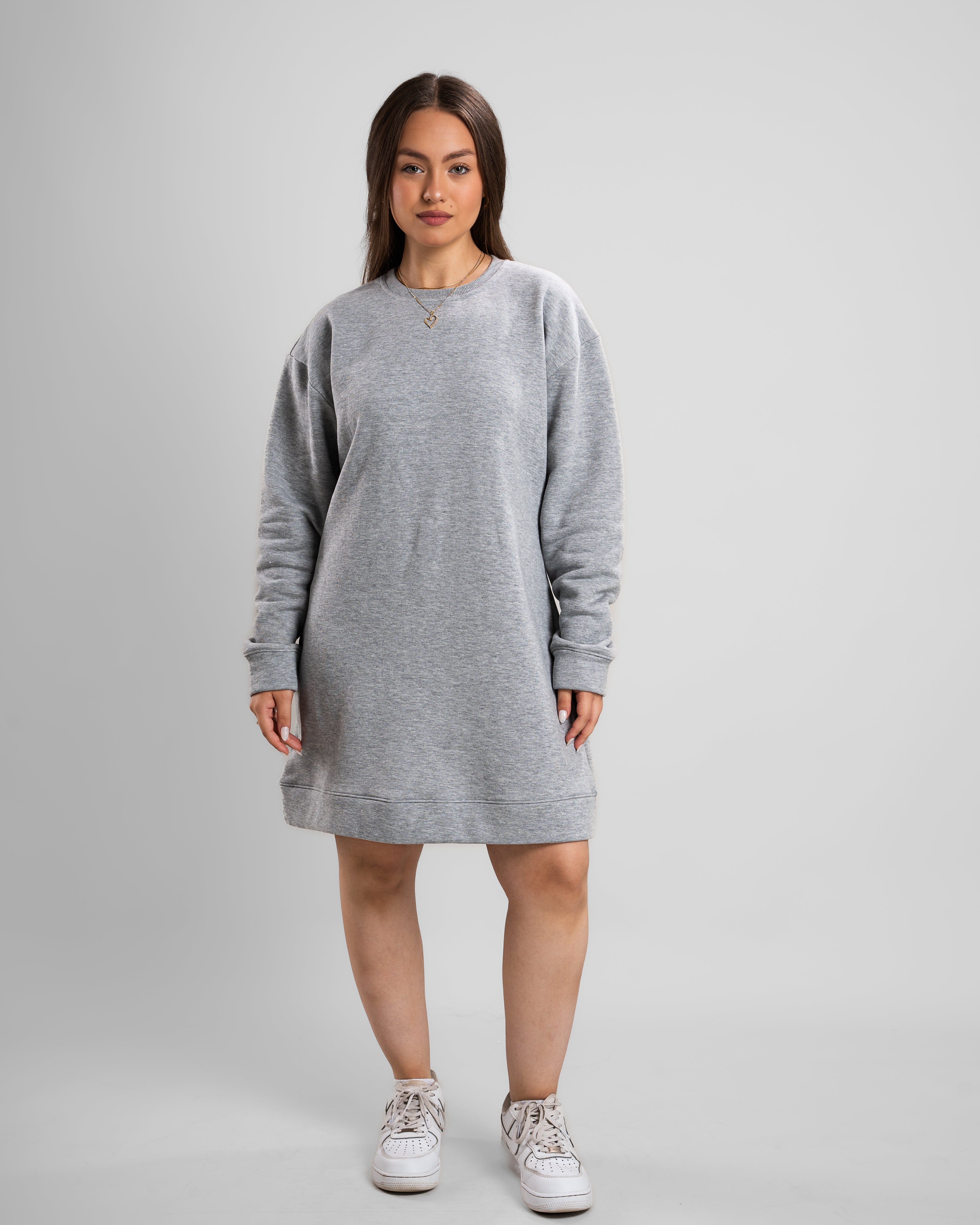 Front look of Model wearing a grey Crew Neck Short Dress with long sleeves, casual style.