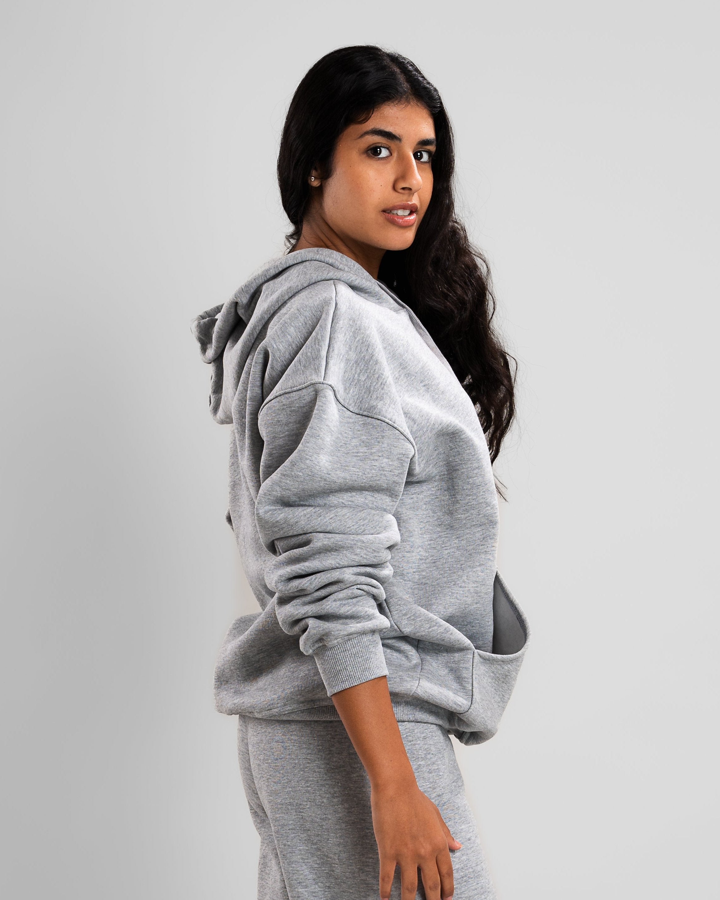 Model wearing a grey Casual Basic Hoodie in heavy Melton fabric, relaxed fit.