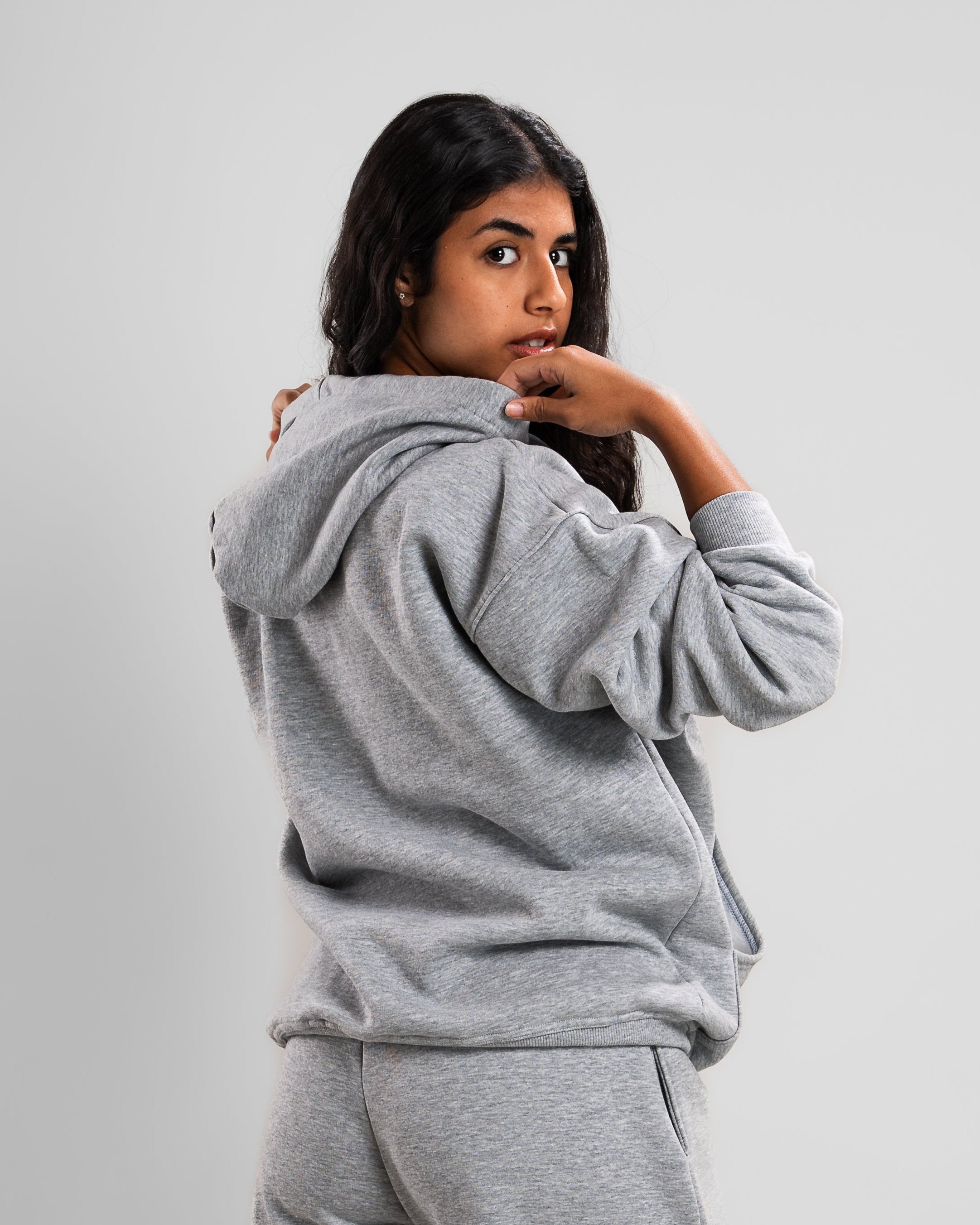 back view of cozy grey hoodie with front pocket, perfect for winter layering